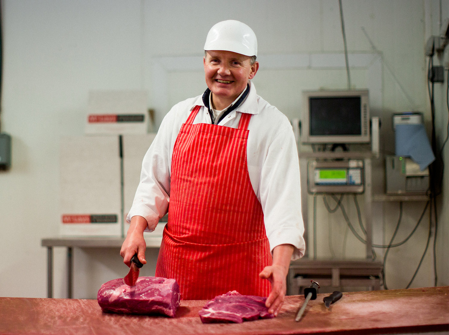 McLays butcher cutting meat